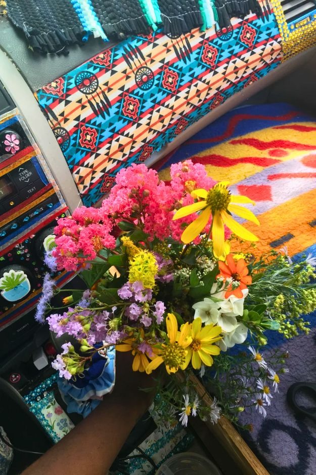 Patterned cushion with tassels in car